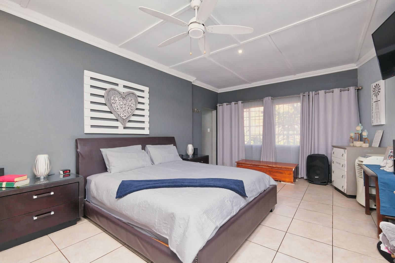 Master bedroom with full-height wardrobe in the Koregaon Park apartment