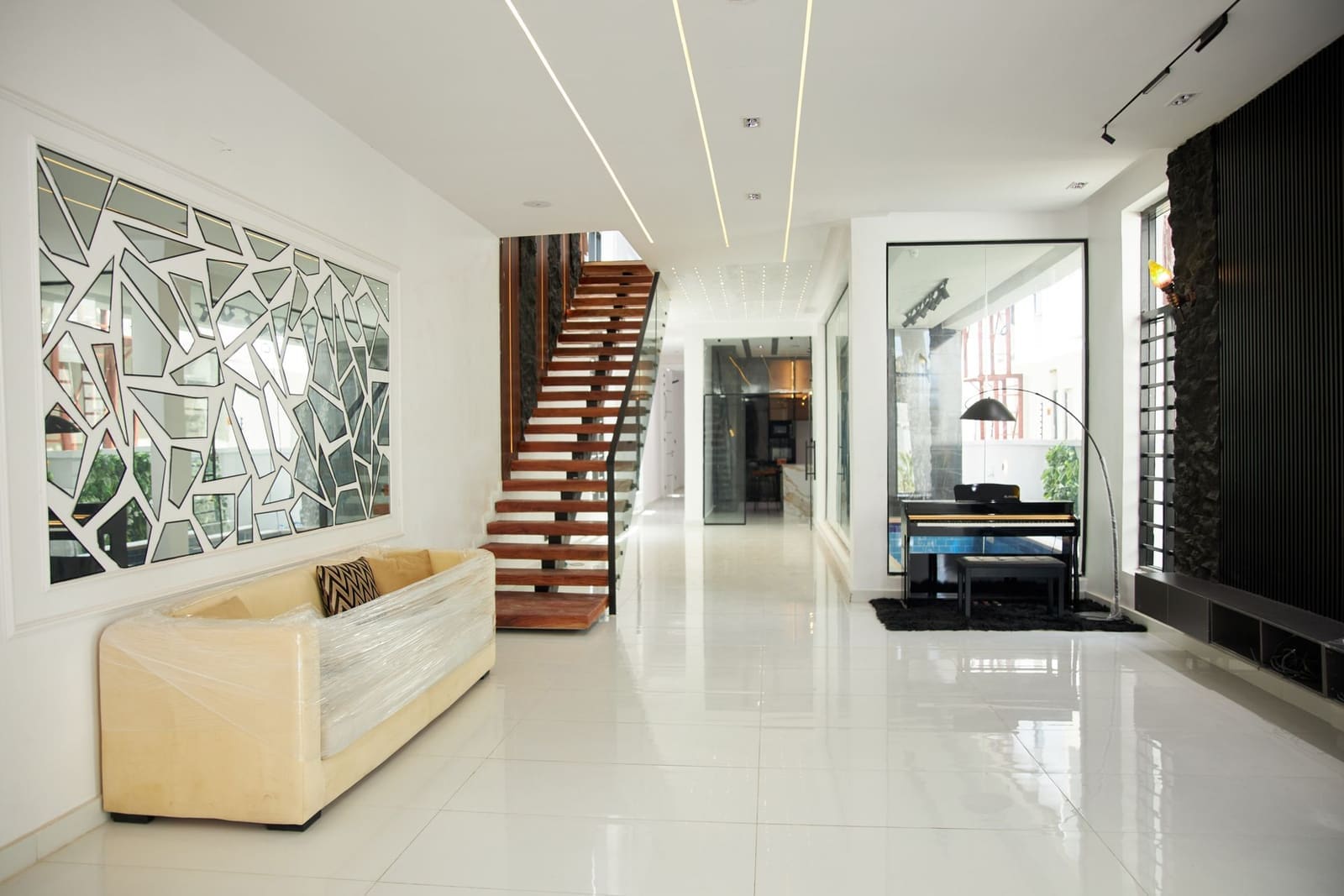 Open staircase with timber treads in a Karve Nagar bungalow in Pune